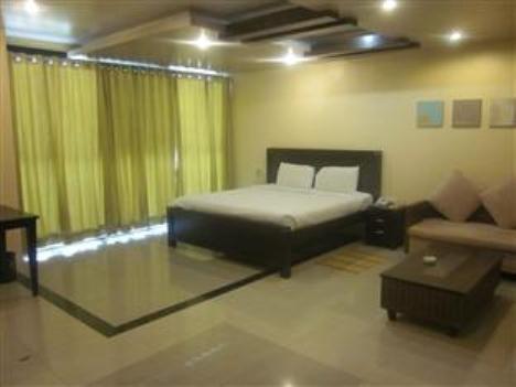 Hotel The Elite Suites Πούνε Δωμάτιο φωτογραφία